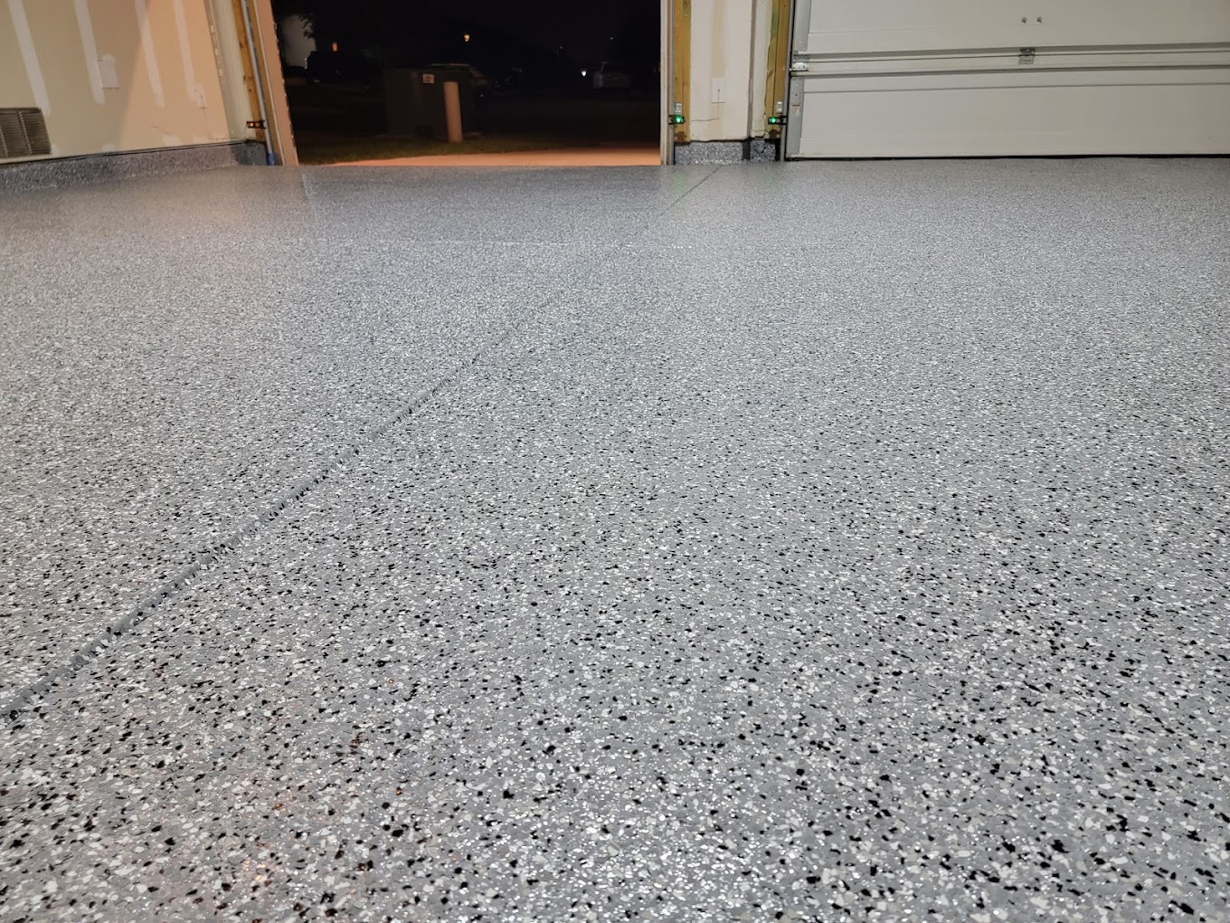Close-up of completed AmazaCrete decorative flake garage floor